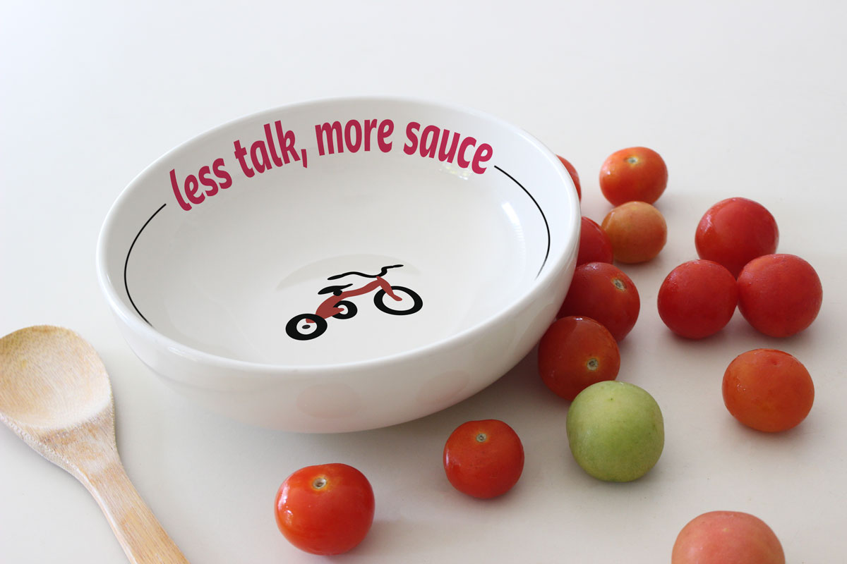 a sauce bowl with angelinas logo with tomatoes and wooden spoon