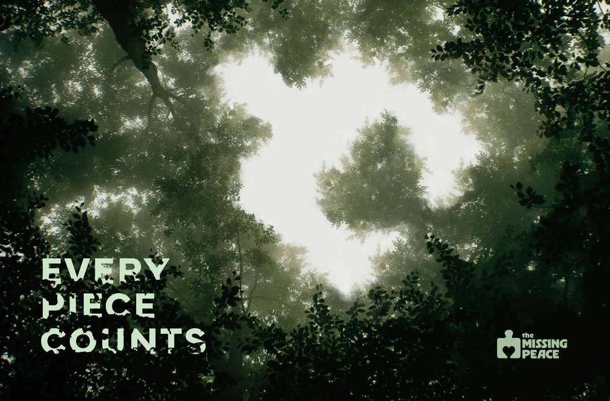 an image of trees with the silhoette of the missing piece logo in the branches